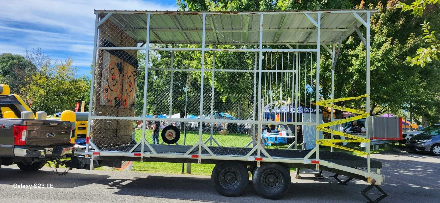 Side view of the 522 Axes silver throwing trailer